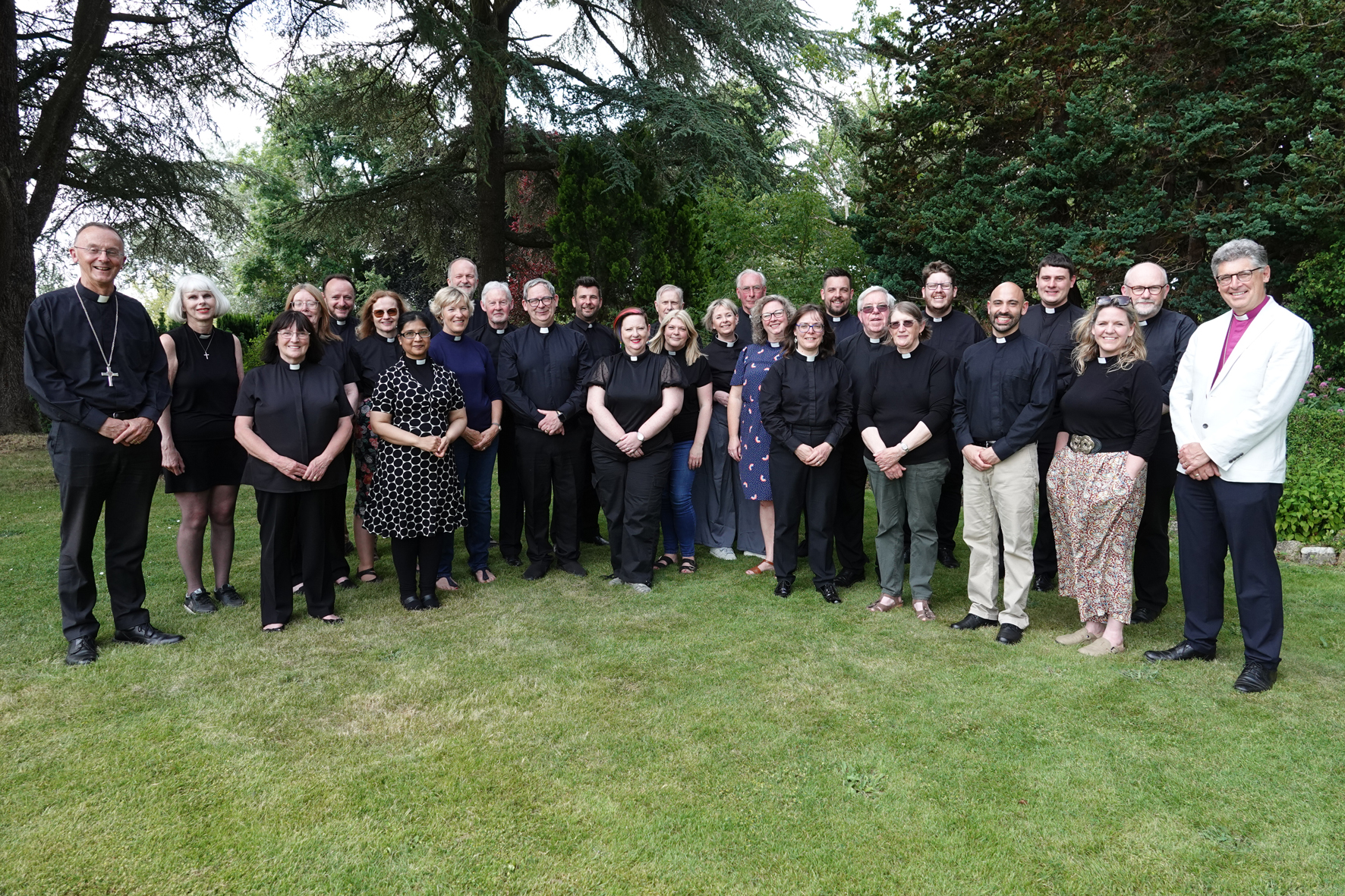 All those who were ordained this weekend standing in Holland House garden with the bishops