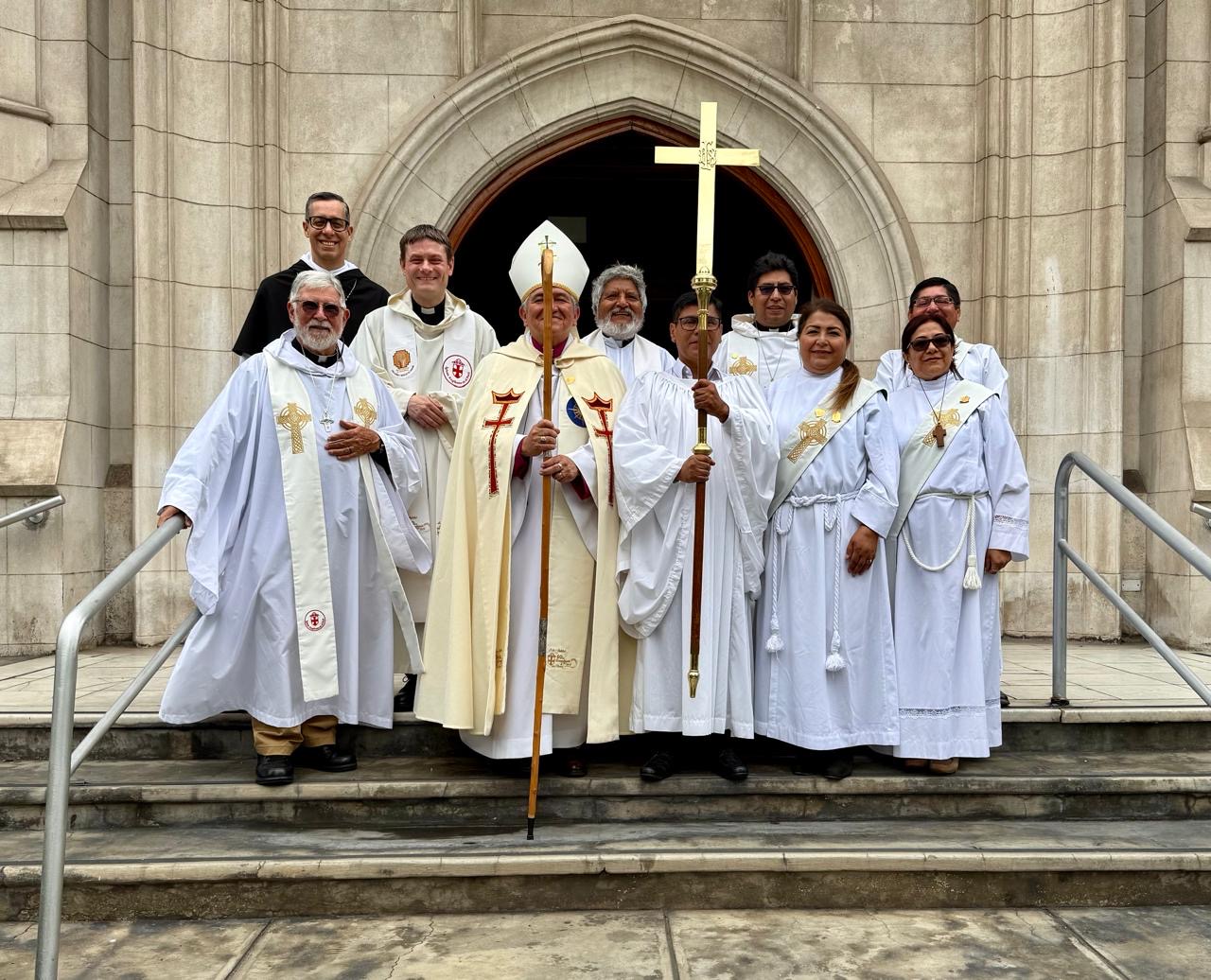 Bishop Jorge, Phil Bradford and others from Lima Cathedral stand in their robes on the steps outside