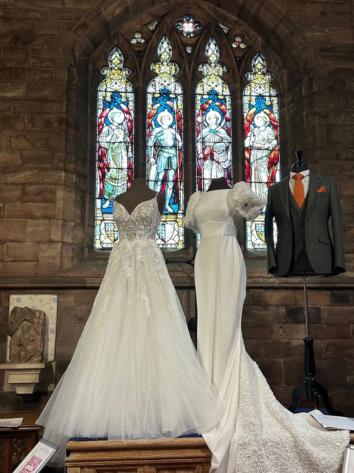 Two vintage wedding dresses and a wedding suit