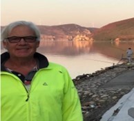 Robert Juckes stood in front of a view of a coastline