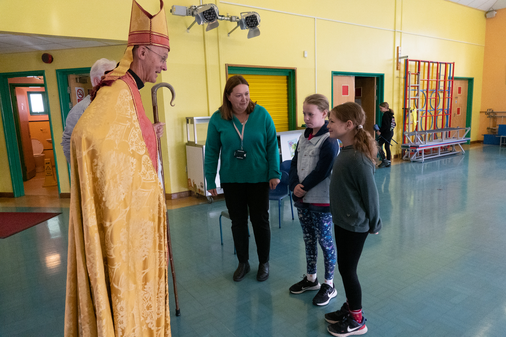 Bishop John with Becky Enstone, Charlotte and Phoebe at Harvington school