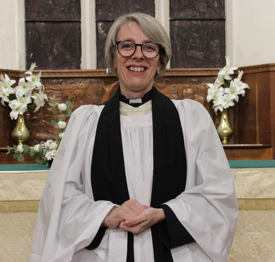 Sarah Roberts-Malpass standing in front of the altar at St Mary Kingswinford