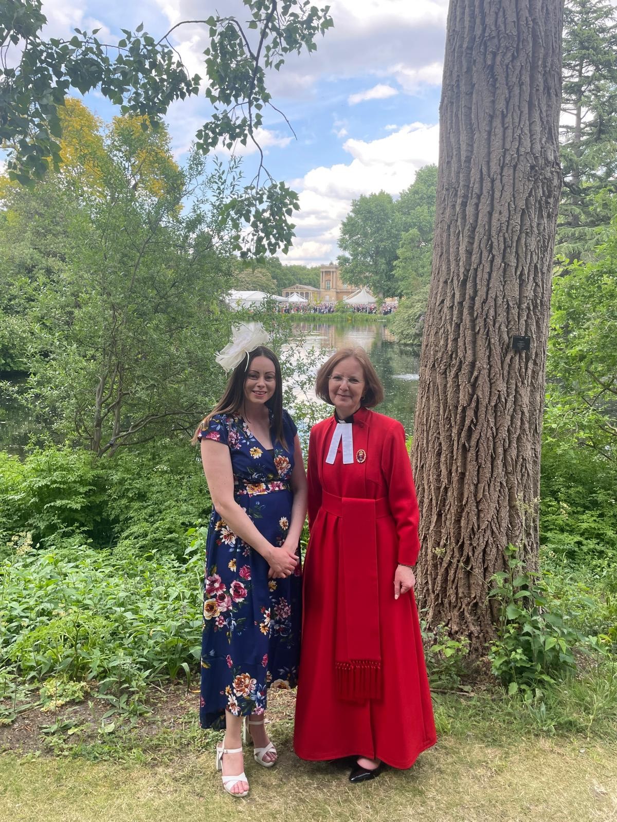 Kalantha Brewis in her scarlet Royal Chaplain cassock and benefice administrator Lorna in the grounds of Buckingham place