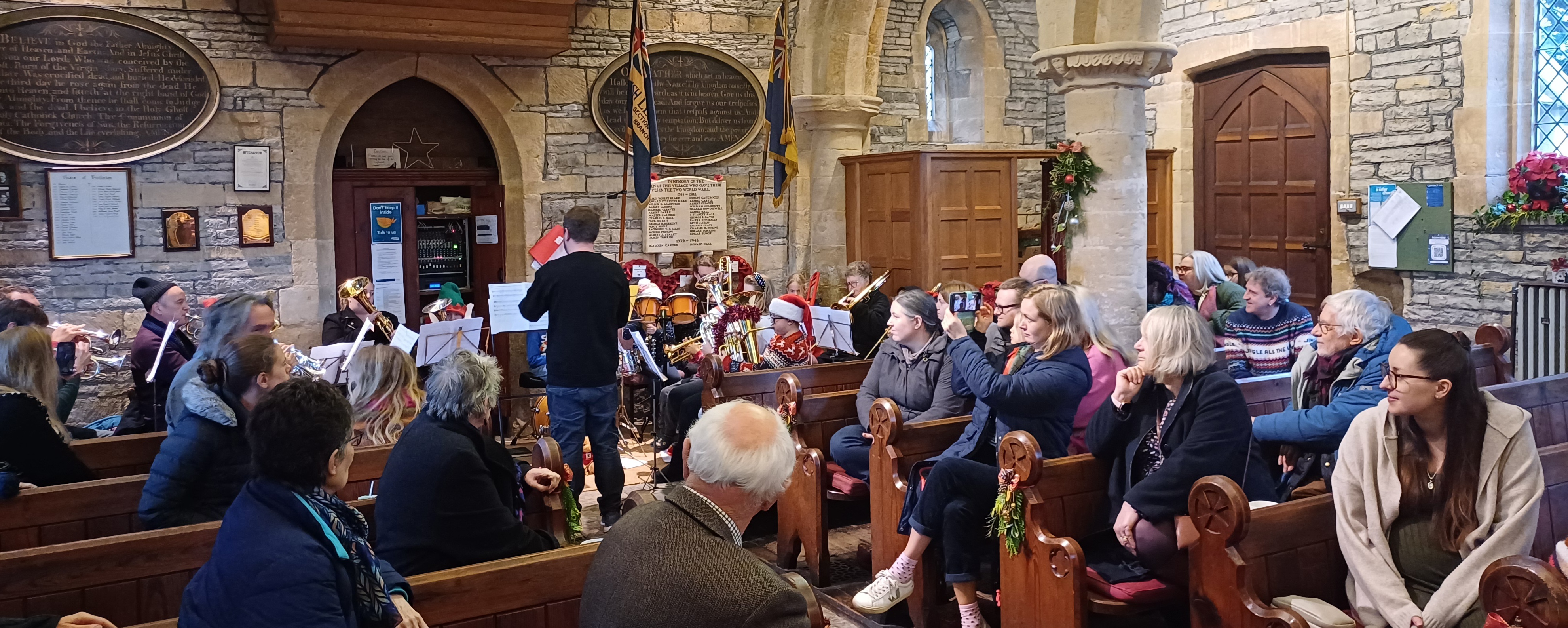 The Bretforton junior band playing at the front of St Leonard's Church