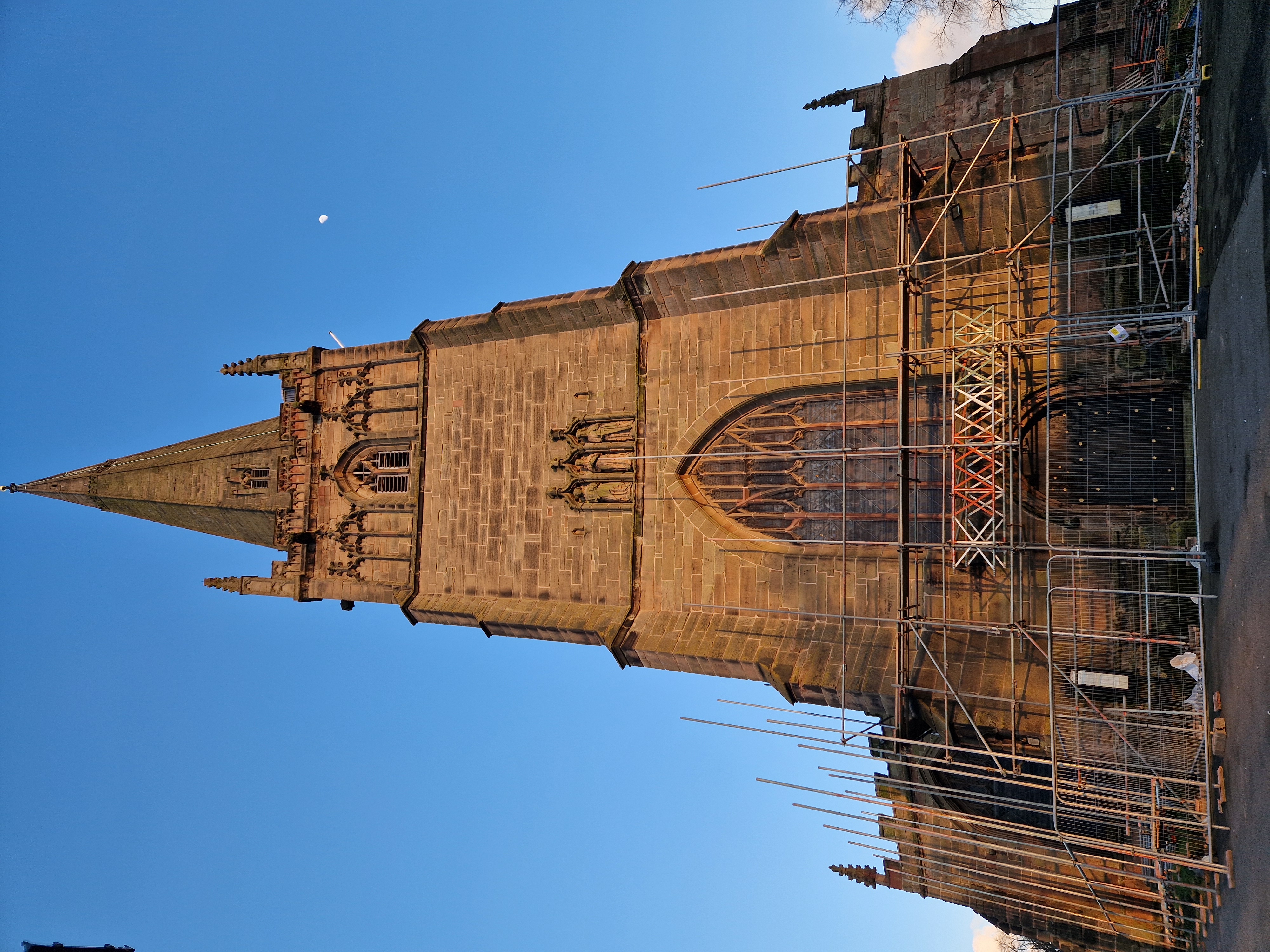 Picture looking up at St John's church spire as the scaffold is starting to be built at the bottom