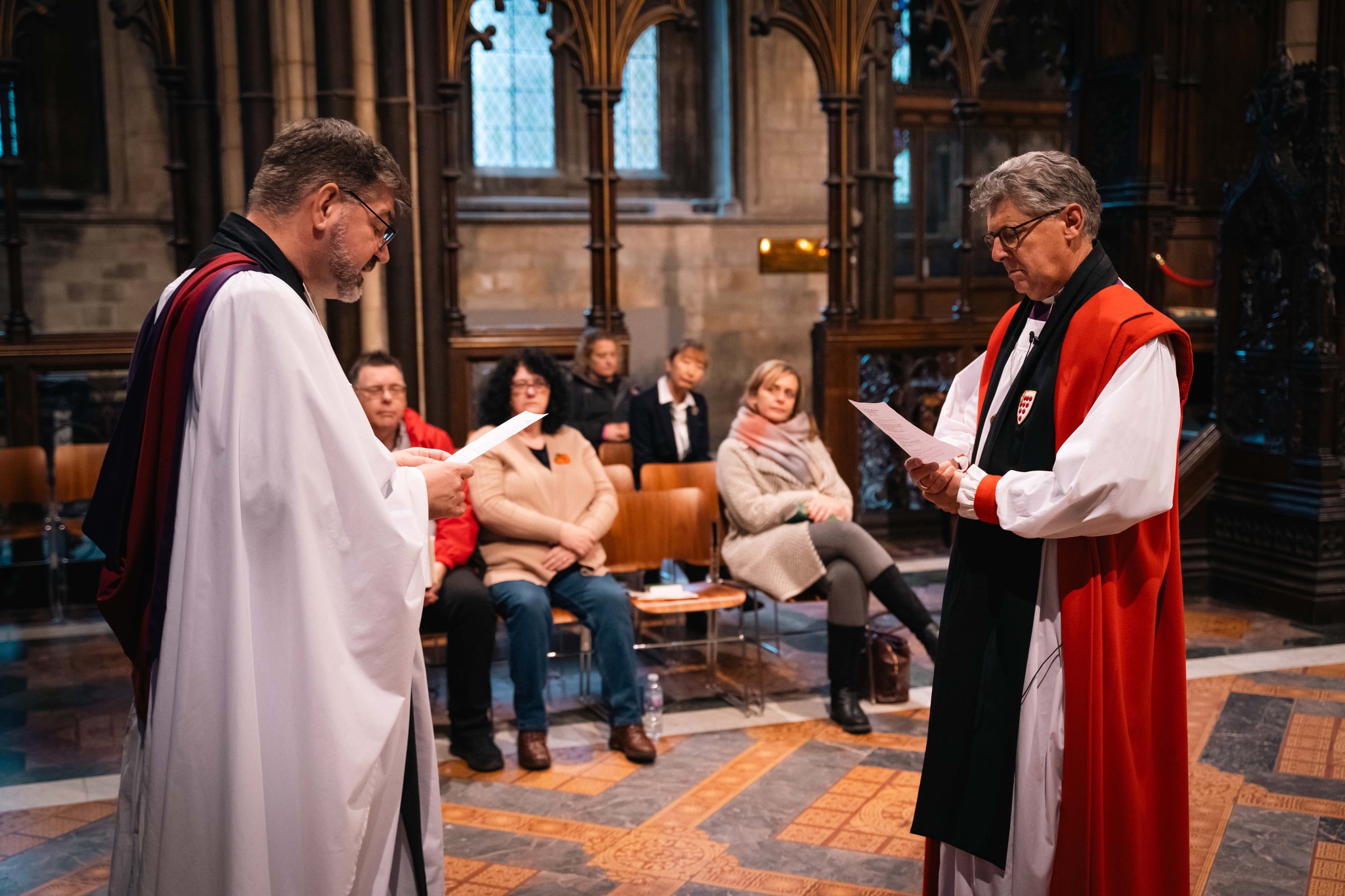 Bishop Martin standing in front of the Dean in the Quire as he's commissioned Acting Bishop of Worcester