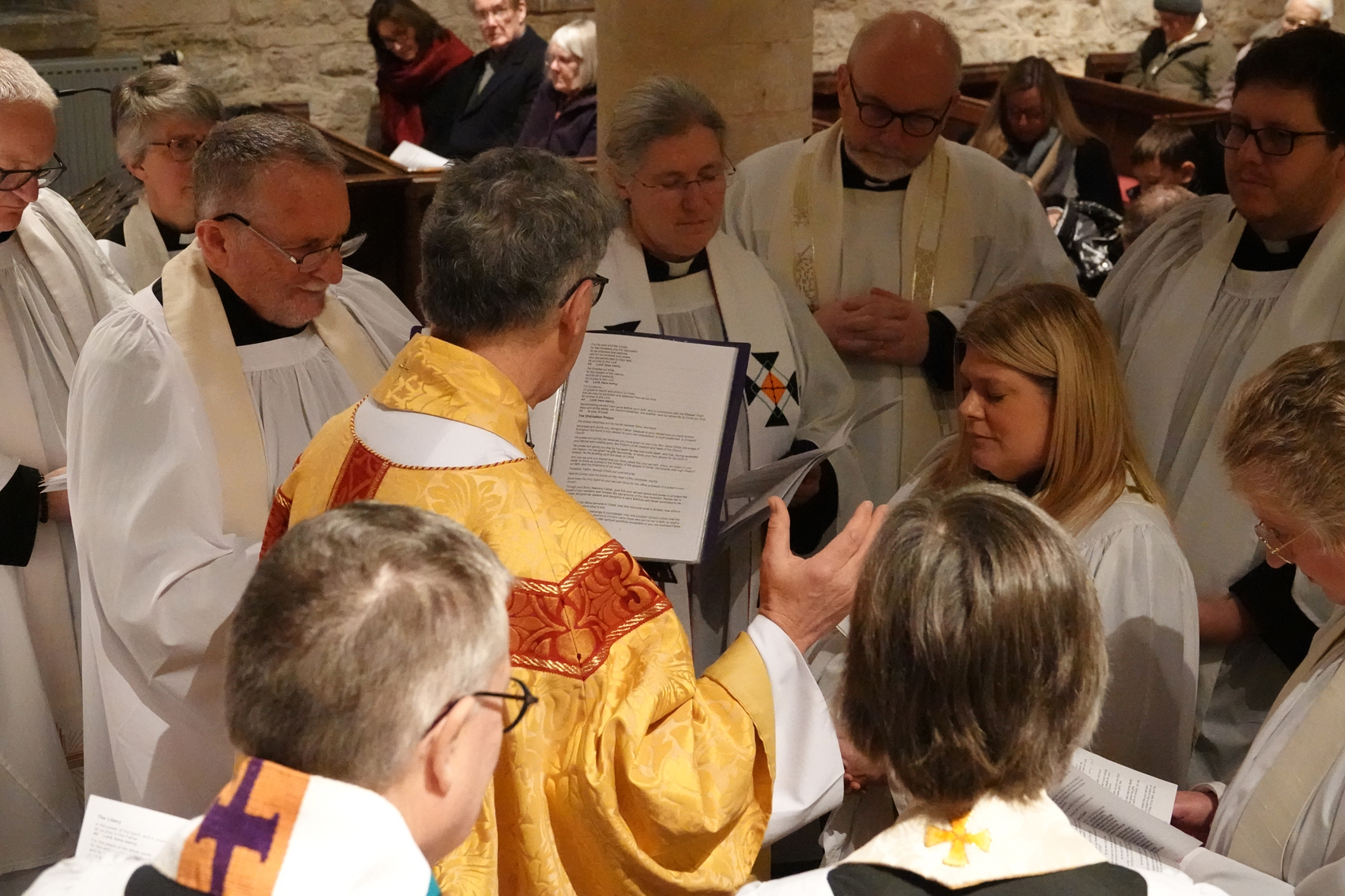 Bishop Martin ordains Sooz surrounded by other clergy