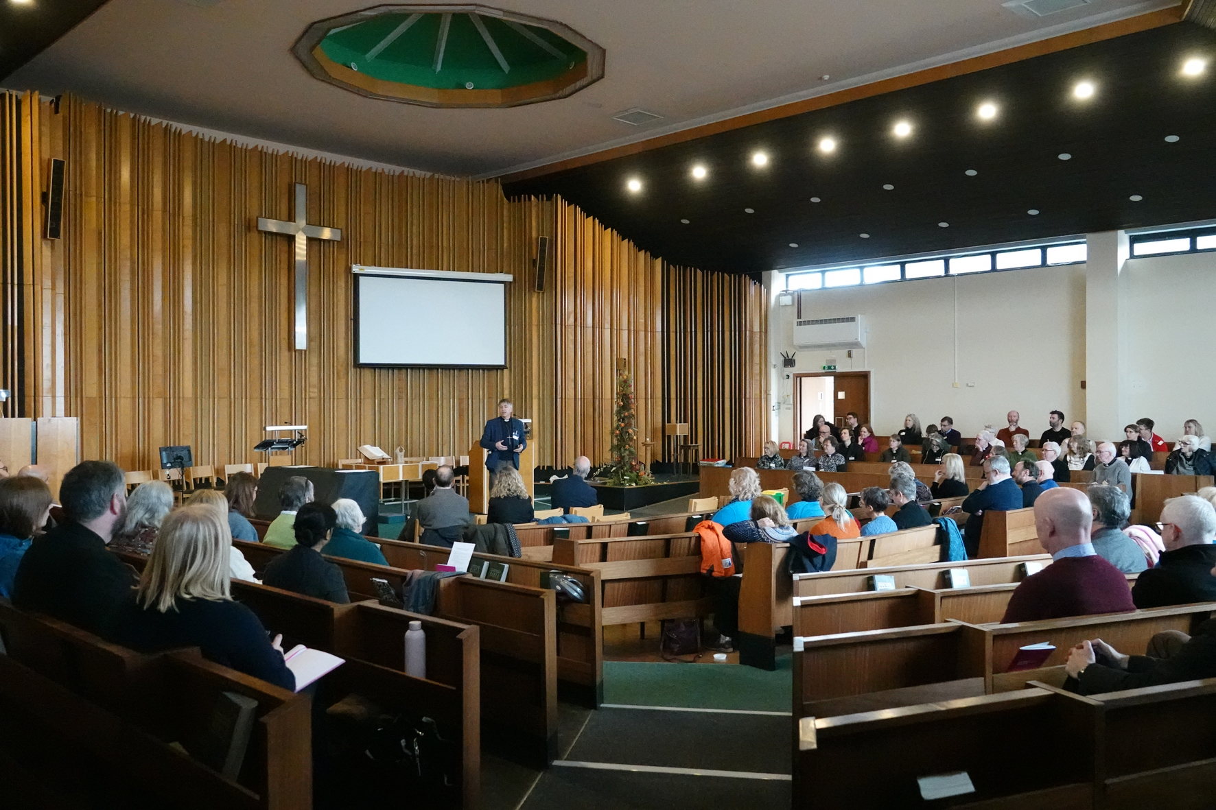 Clergy sat in St Andrew's methodist church with Bishop Hugh talking to them from the front