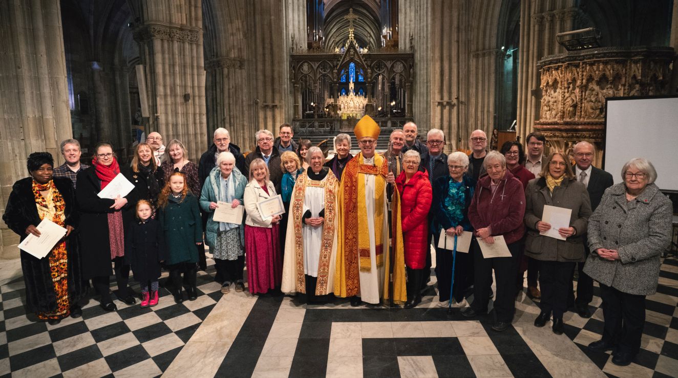 ALMs after they've received their certificates standing in a group with Bishop Martin & Archdeacon Nikki in the cathedral