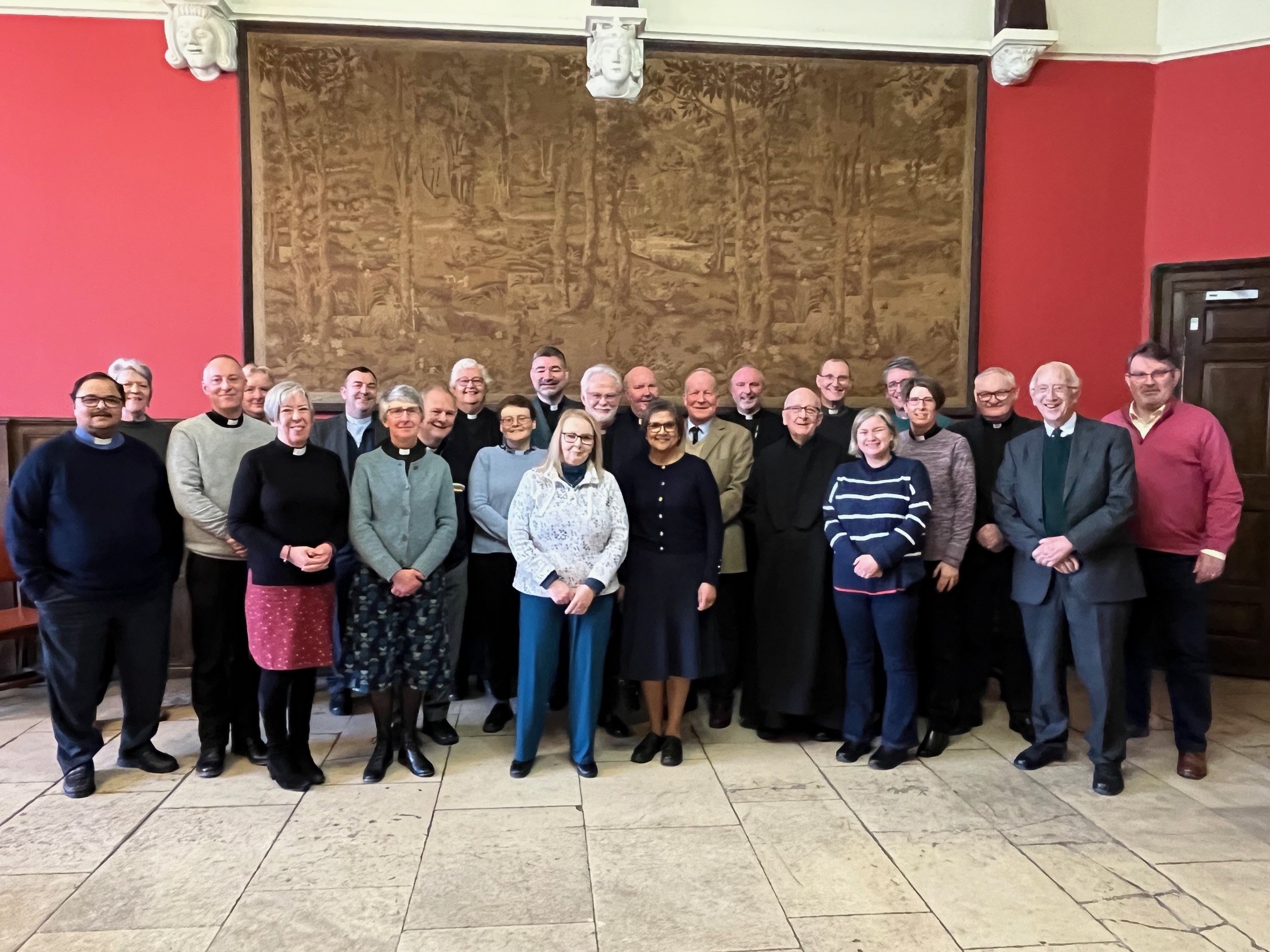 College of Canons standing in the Great Hall at the old palace