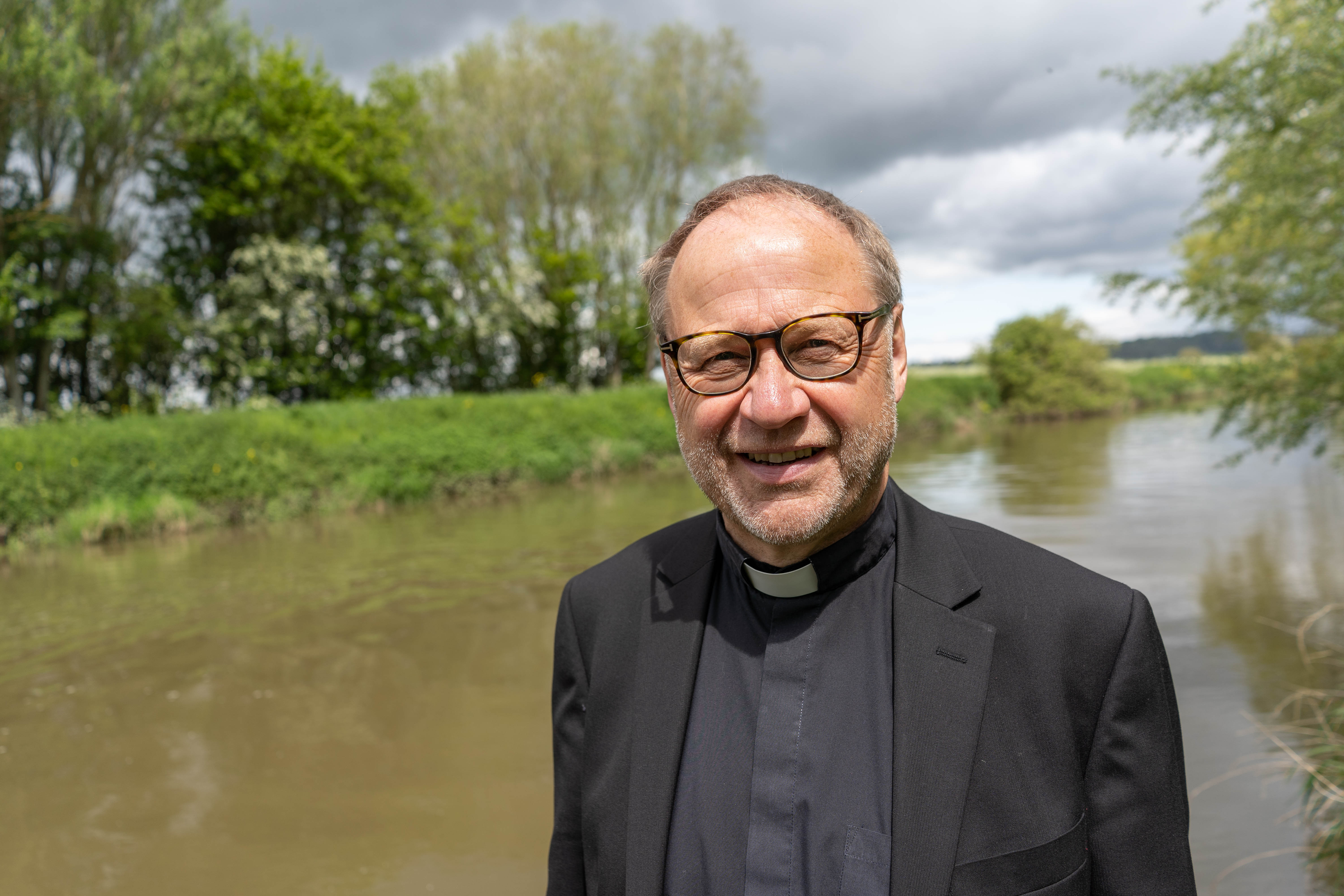 Archdeacon Robert in front of the river Avon