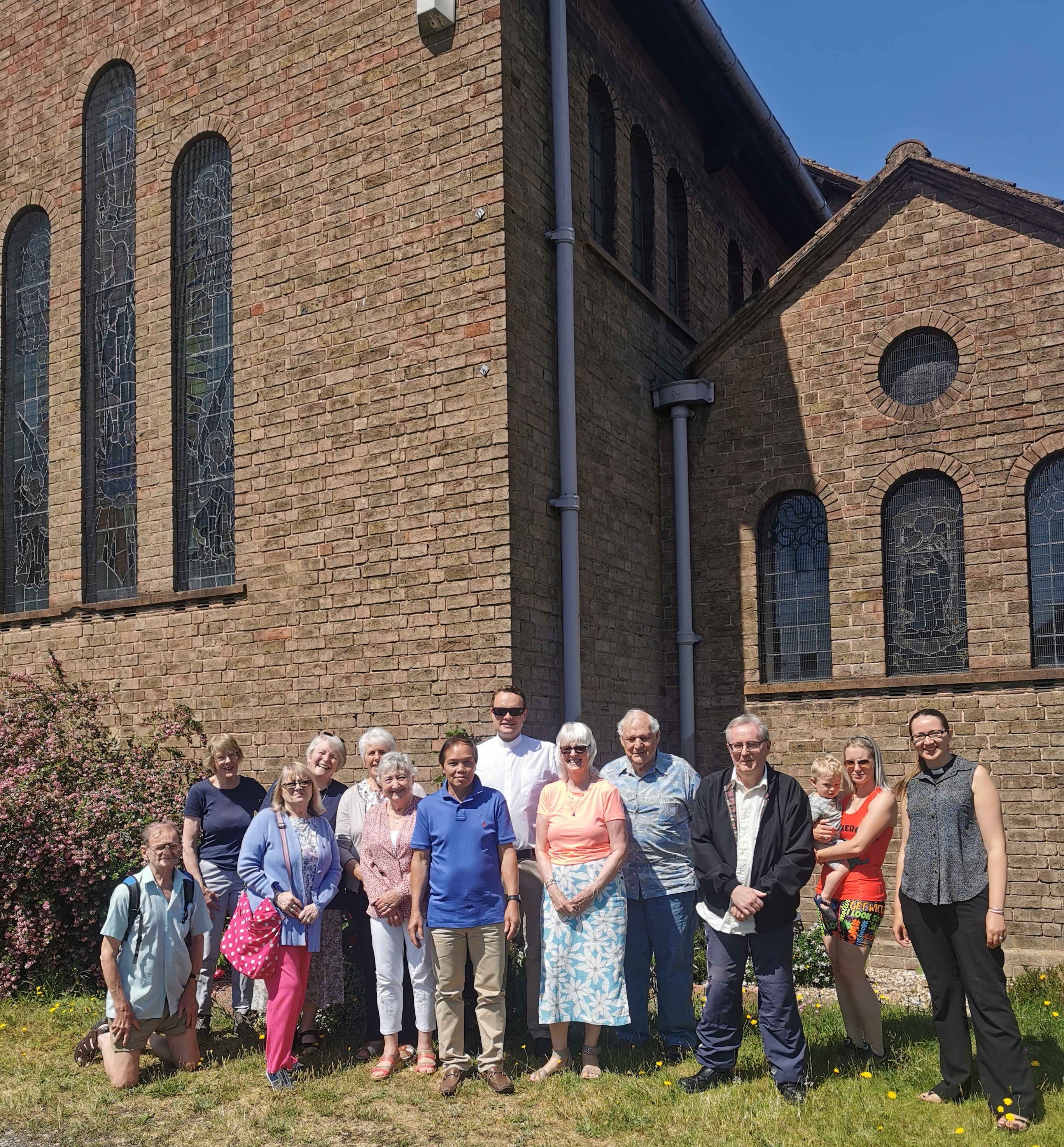 members of Holy Innocents church standing outside the church