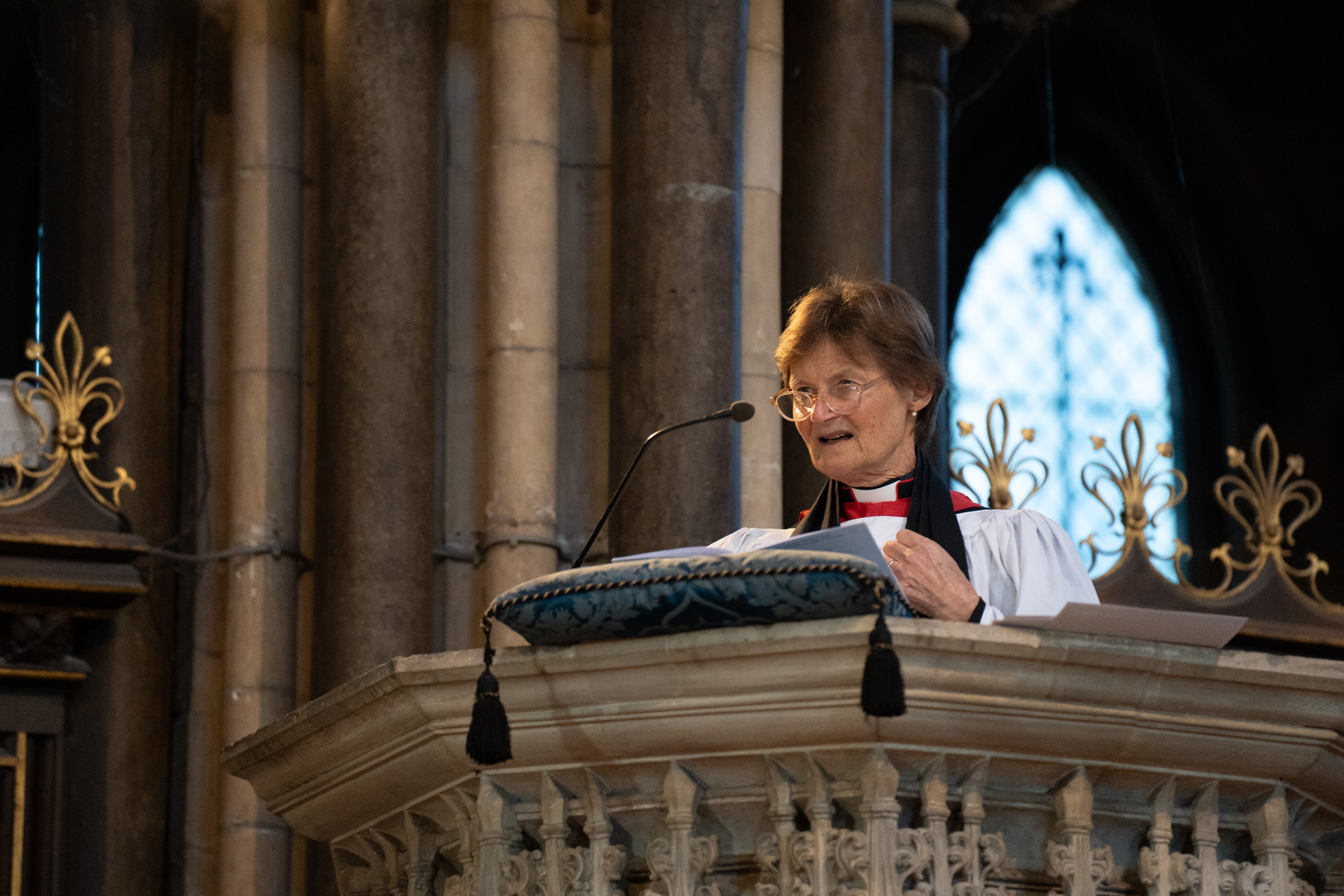 Bishop Olivia Graham in the pulpit of the Quire proclaiming the election of Bishop Hugh