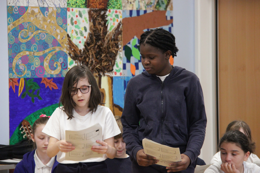 Lillian and Dorothy from St Barnabas school standing to read during the service.