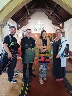 Curate Chis, Vicar Adam, Children and Young People's worker, Sian and Headteacher Lindsay with their bags