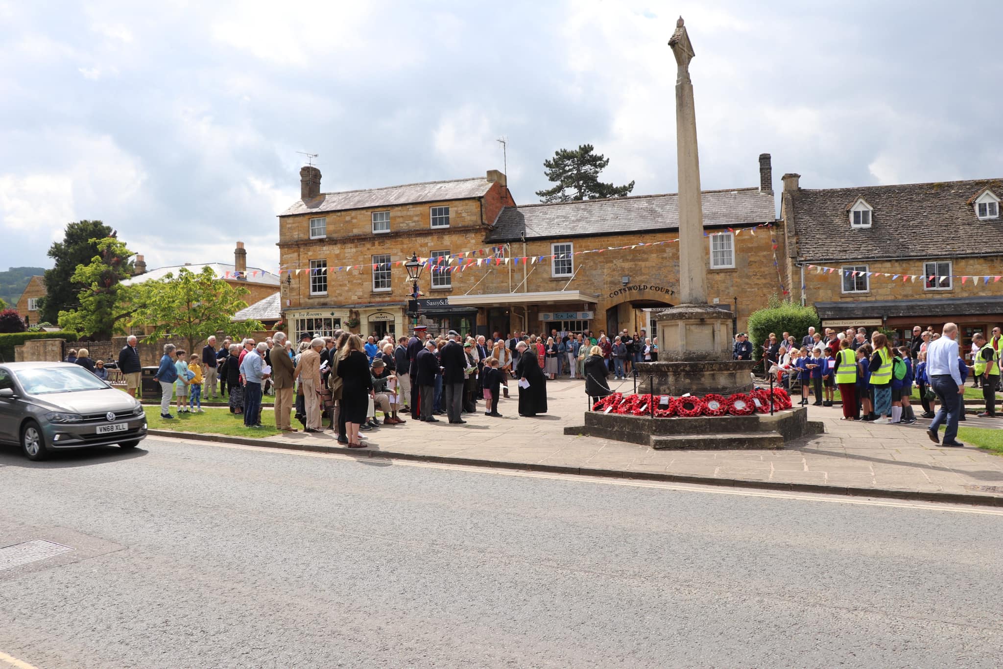 People gathered around the war memorial to commemorate D Day in Broadway