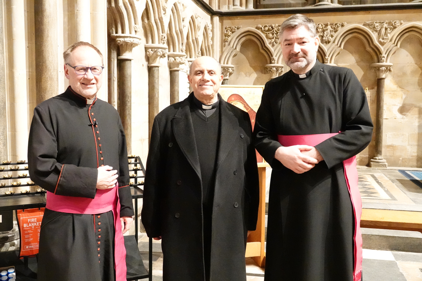 Father Abusada standing between Robert Jones and Stephen Edwards in the Cathedral Lady chapel