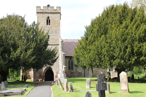 Hampton Lovett church pictured across the graveyard