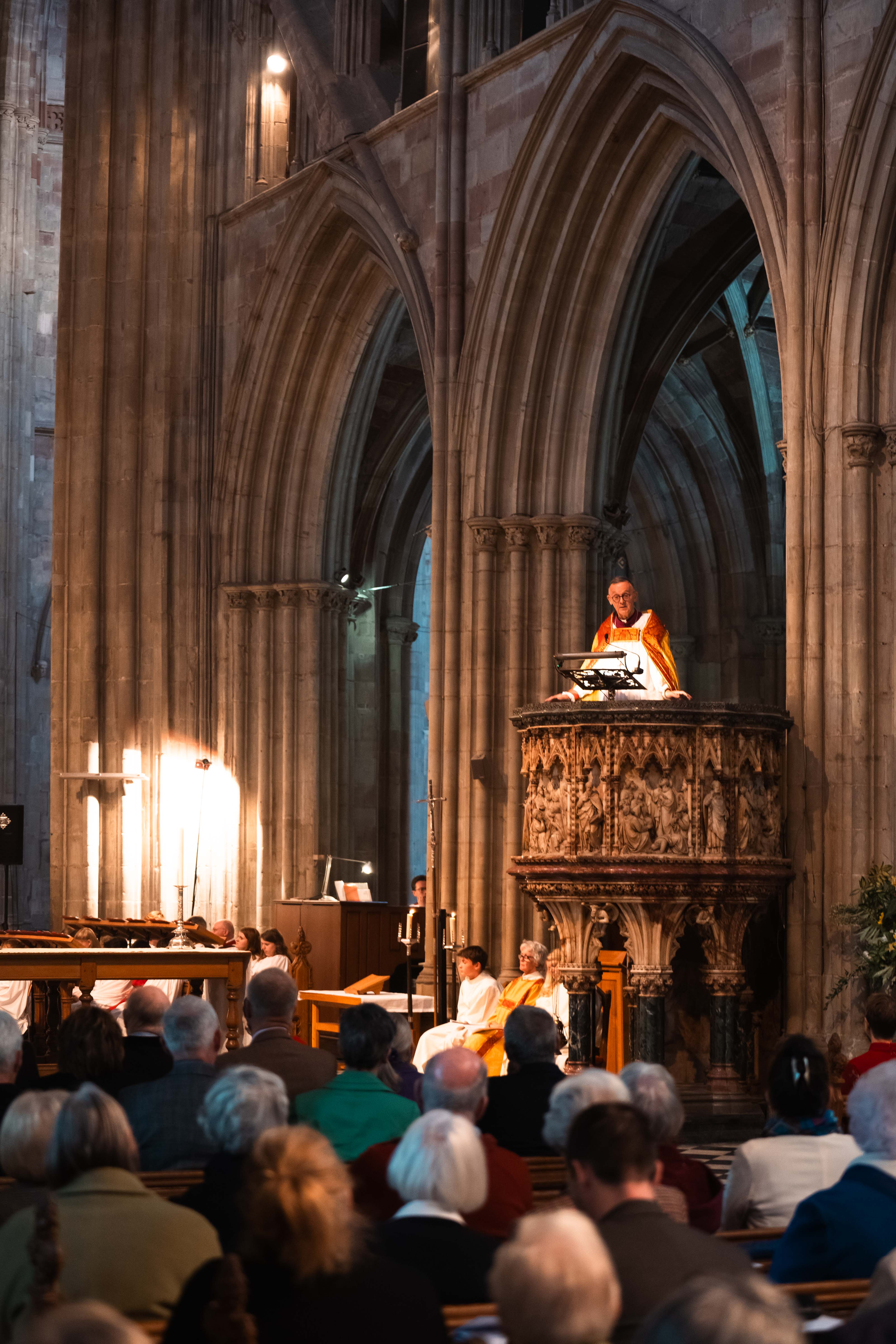 Bishop John preaching in a packed cathedral