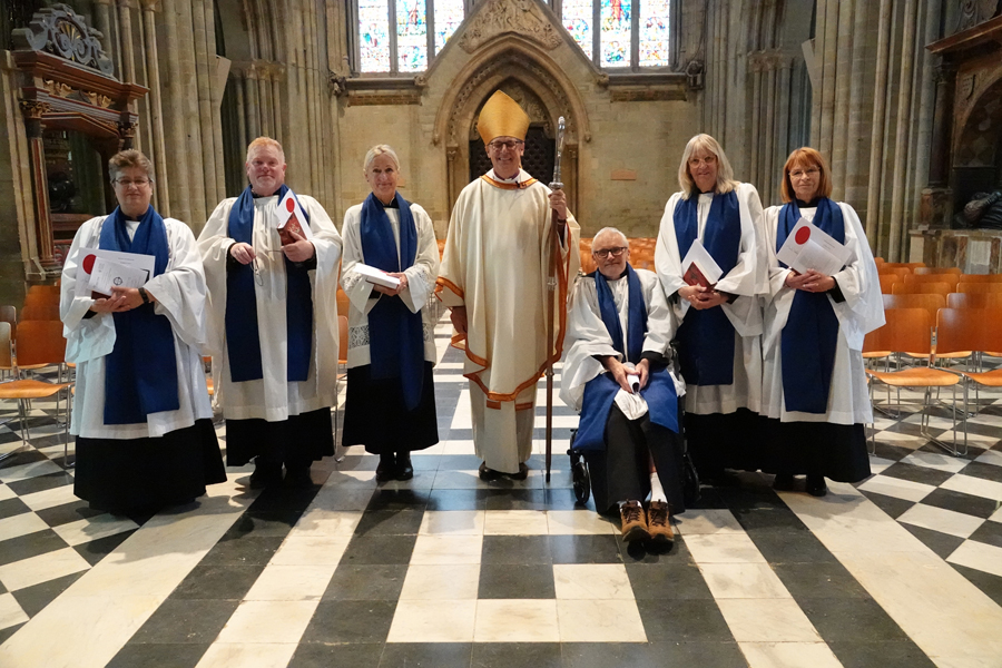 Newly licensed Lay Ministers standing with Bishop Martin at the back of the Cathedral