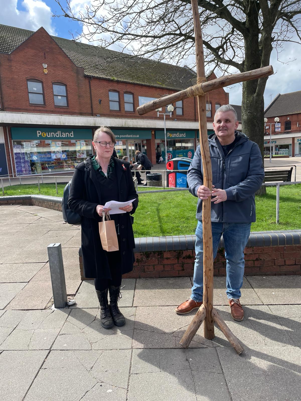 Holding the cross outside the shops in Brierley Hill