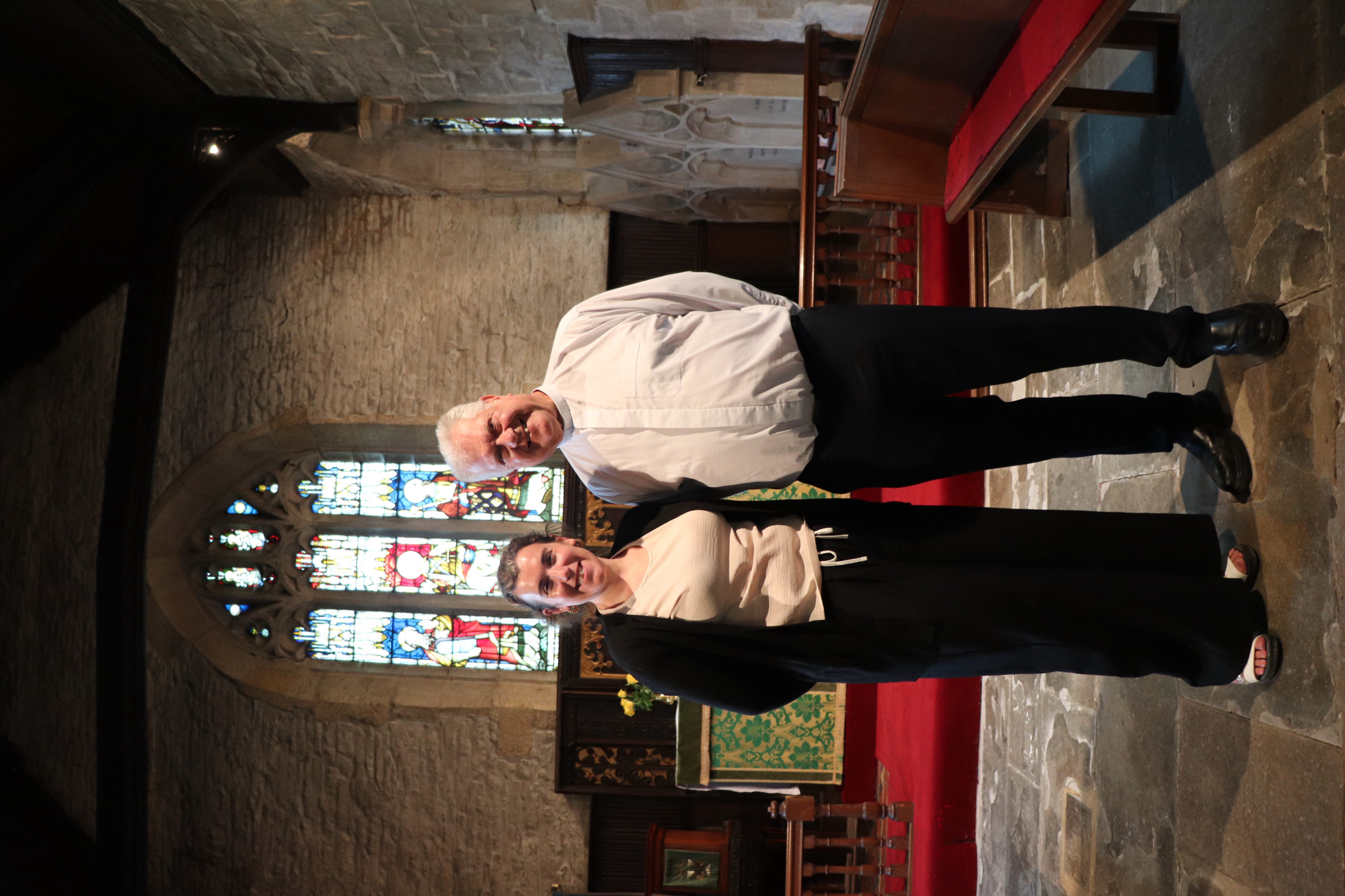 Abi Smith standing alongside Andy Green in church
