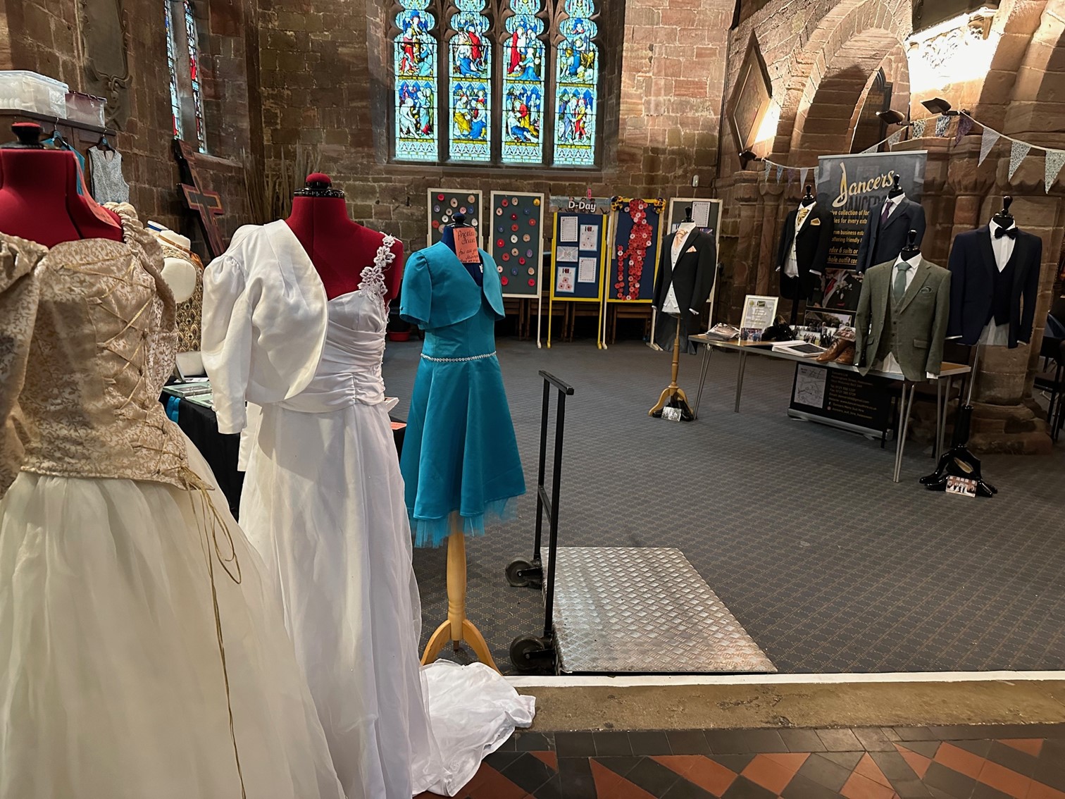 some of the dresses and suits on display at the wedding fayre