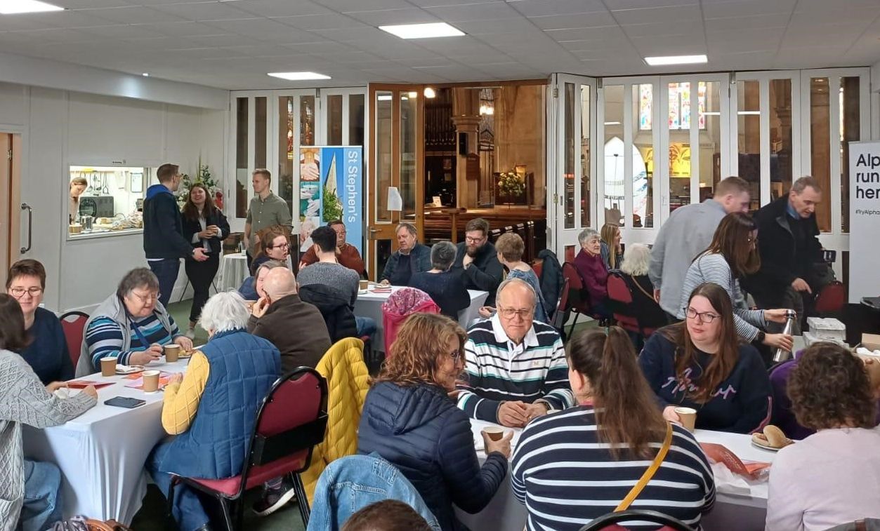 Attendees enjoy coffee, chat and bacon butties