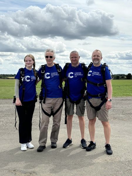 The clifford family in their harnesses after finishing their skydive