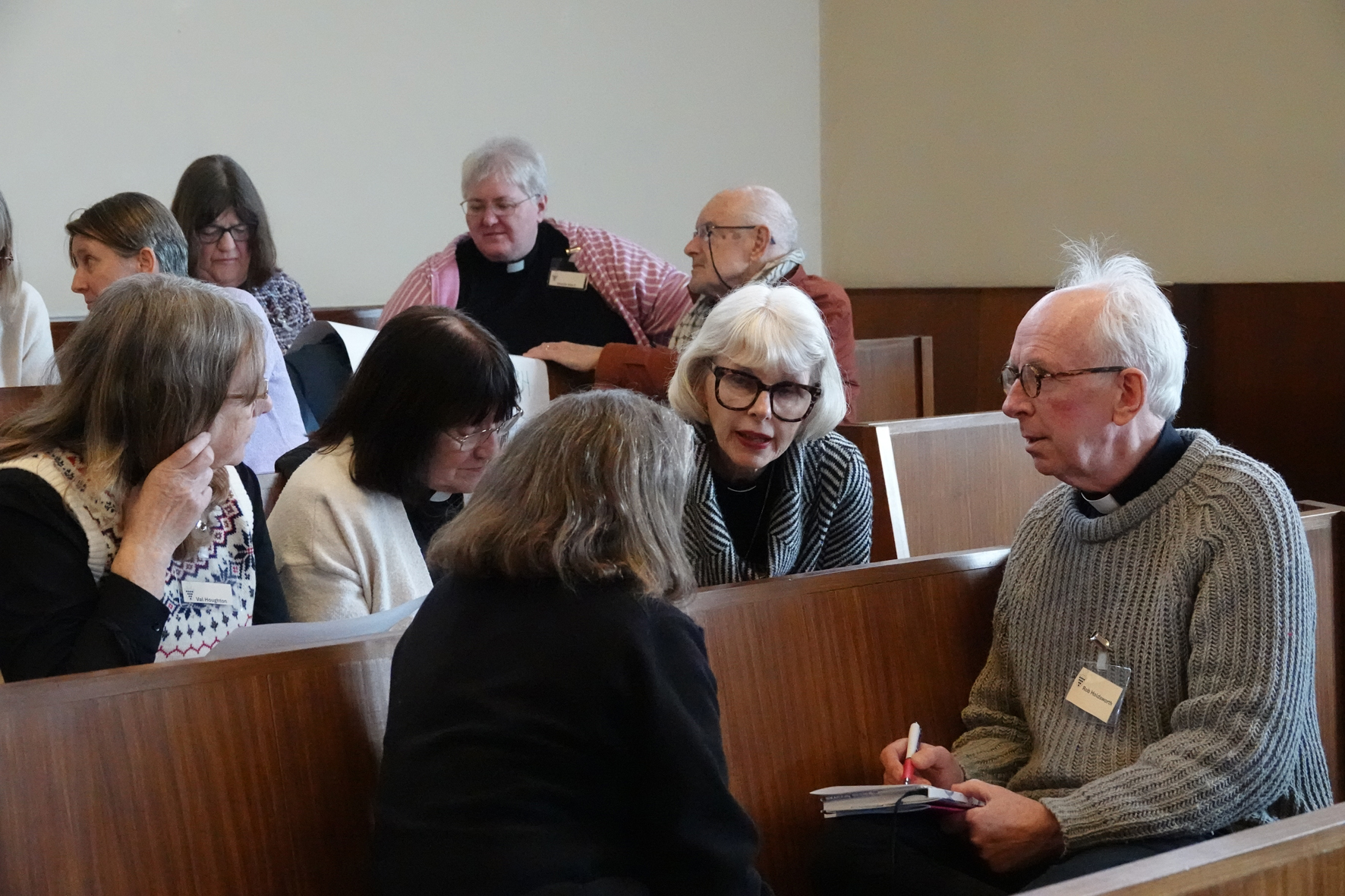 Two groups of clergy having a discussion at the clergy teaching morning