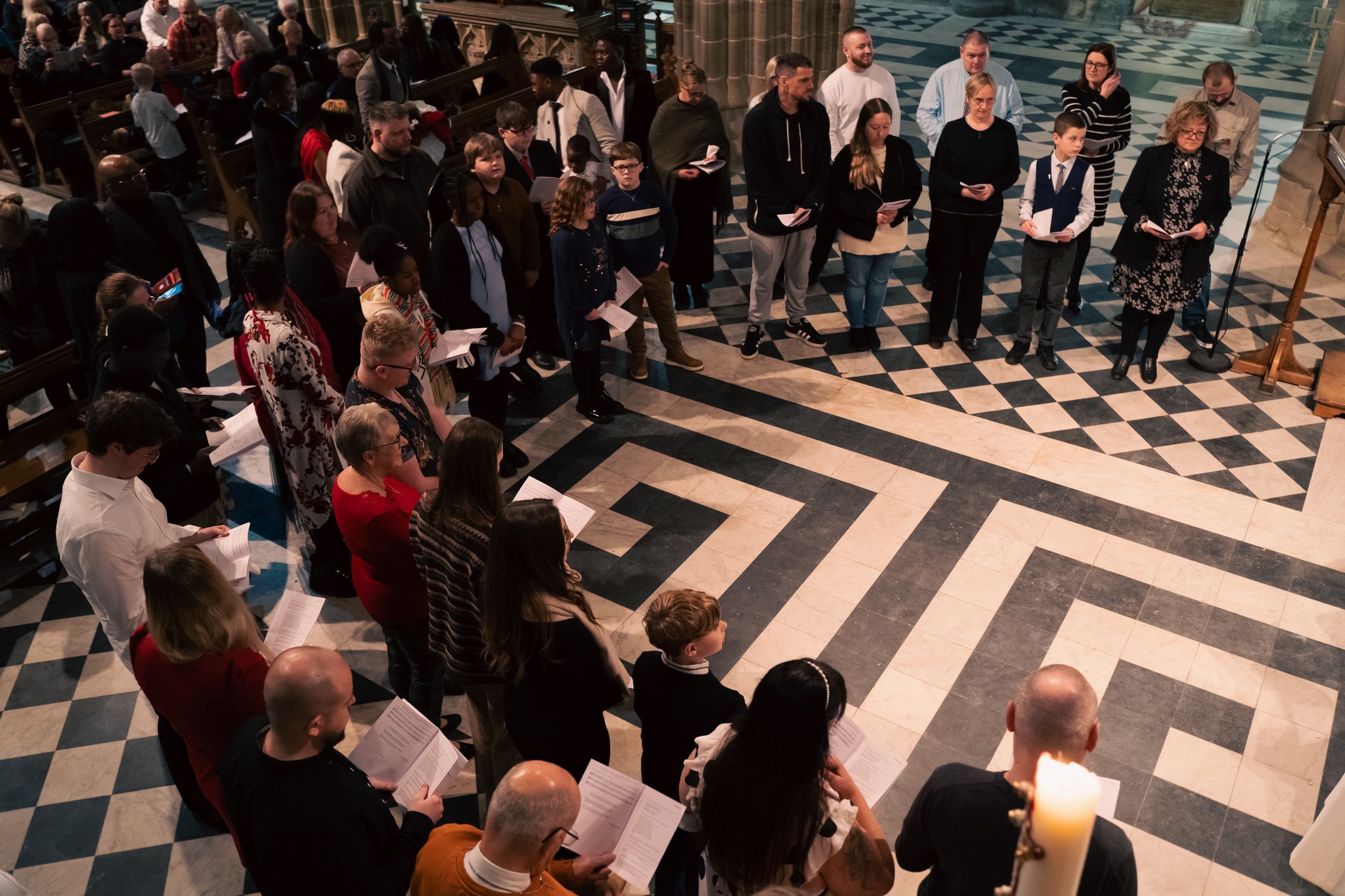 Confirmation candidates standing in two semi circles at the front of the cathedral