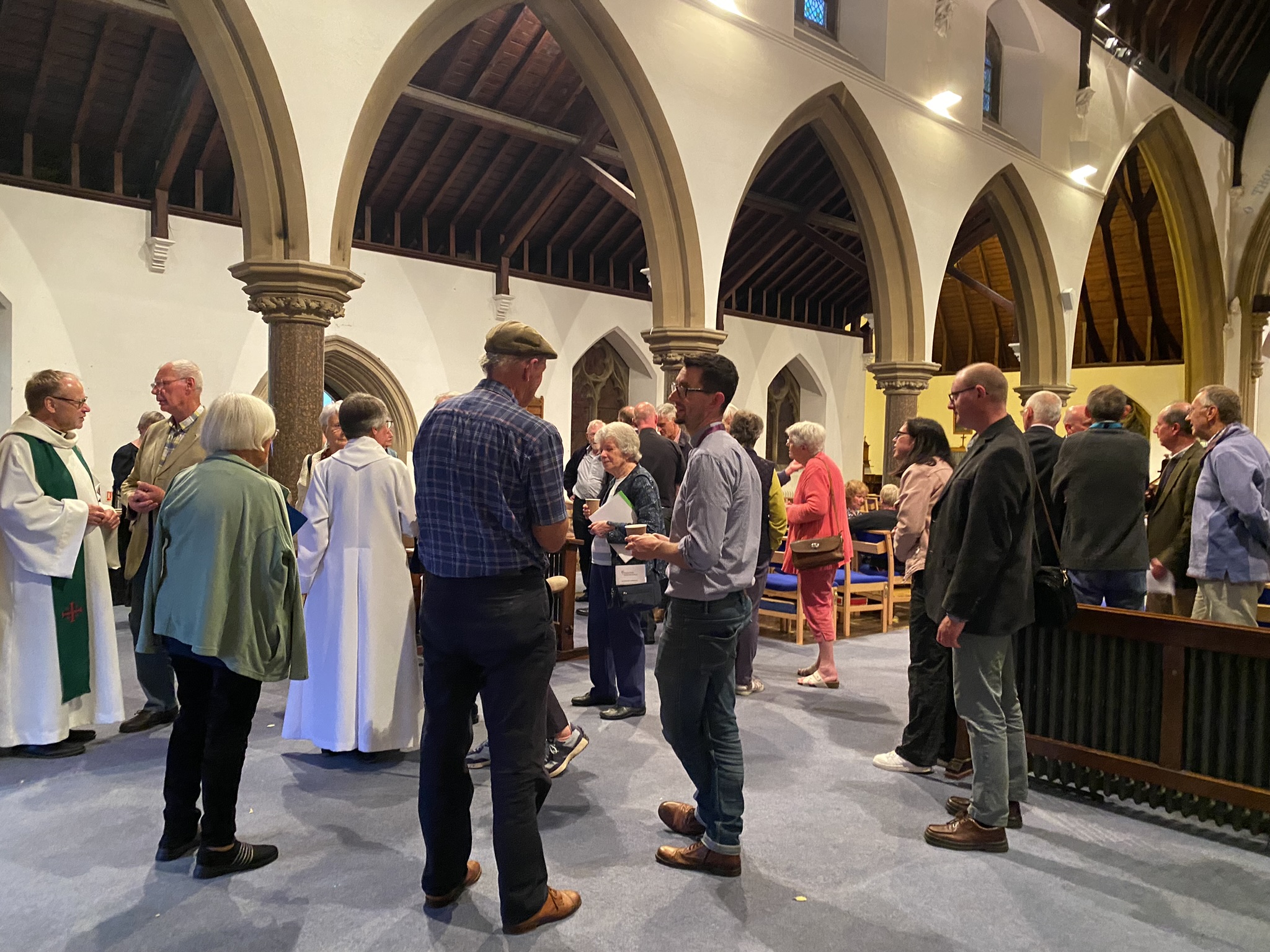 People chatting informally at the celebration of ministries in st Peter, bengeworth