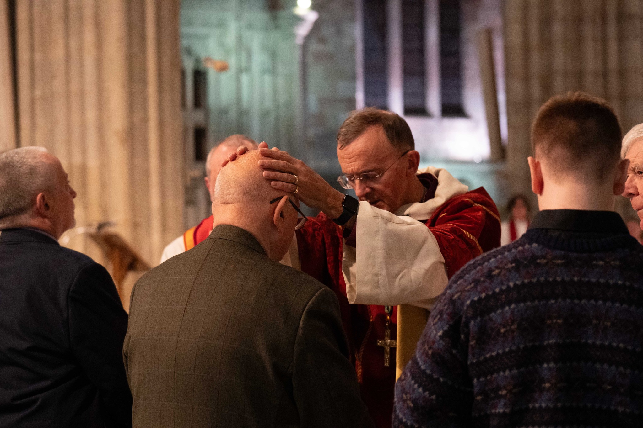 Male candidate being confirmed by Bishop John
