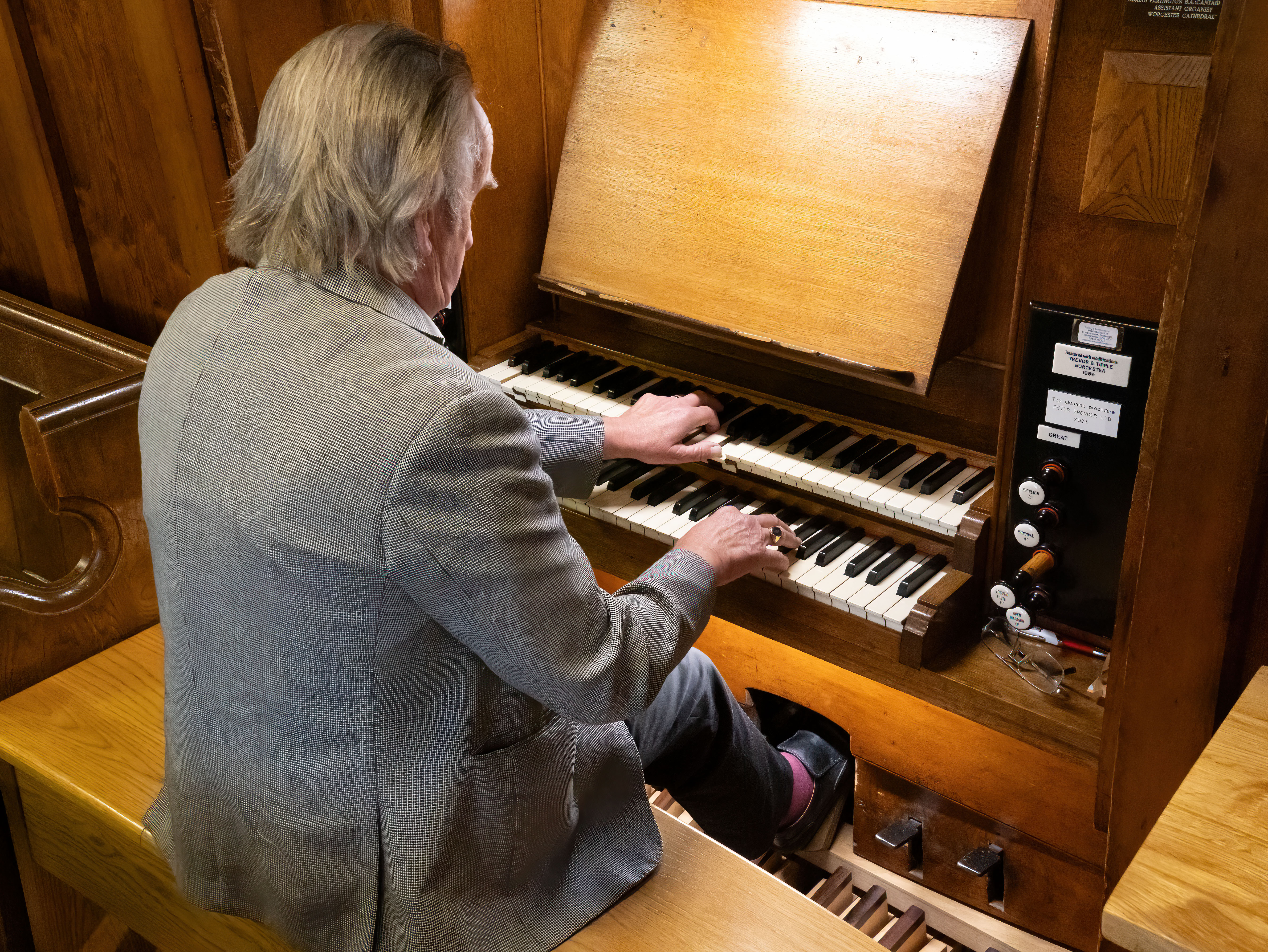 Close up of man playing the organ