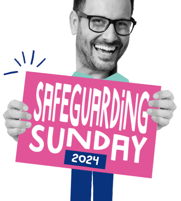 Image of a man holding a Safeguarding Sunday poster