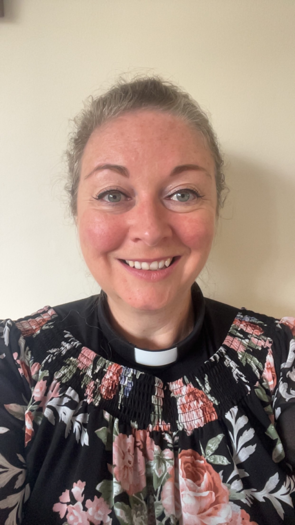 Head and shoulders shot of Claire Cox against a plain background