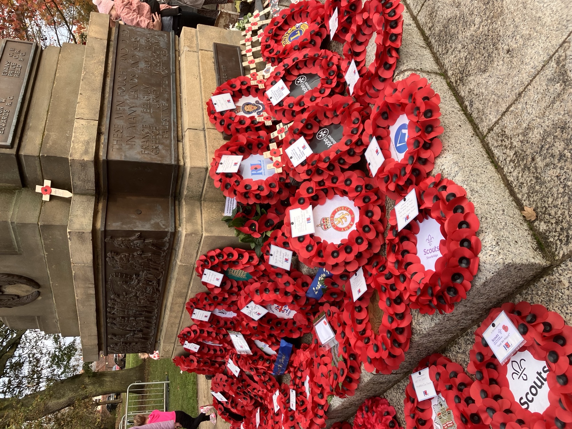 20 Remembrance wreaths placed around the base of the war memorial in Stourbridge