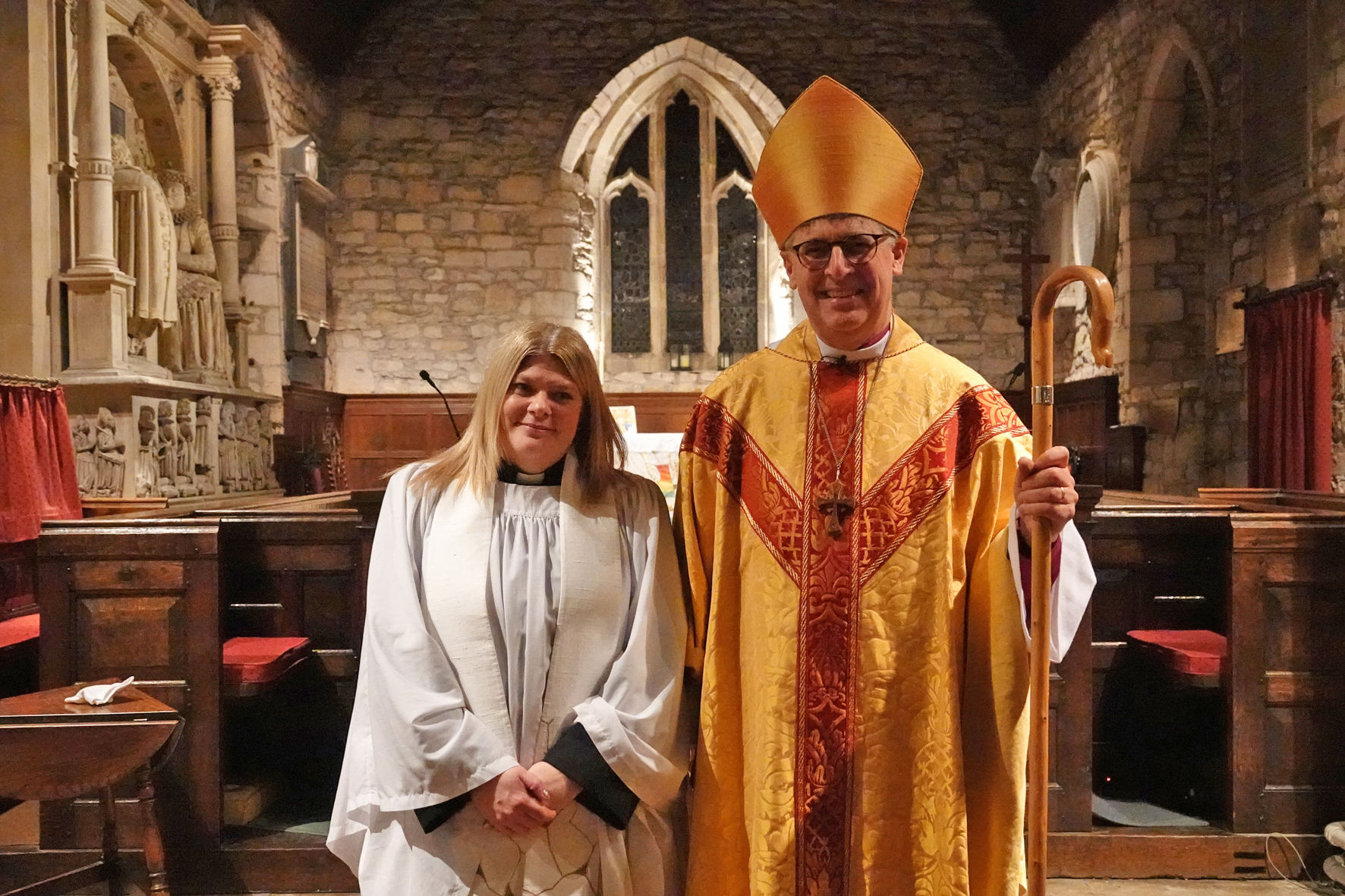 Sooz Magee stands next to Bishop Martin in Eckington church after her ordination