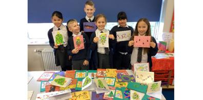 St Oswald CE Primary children with their cards_header.jpg