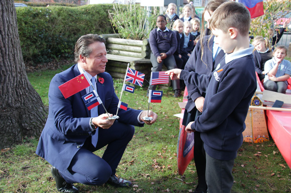 Nigel Huddleston receives flags