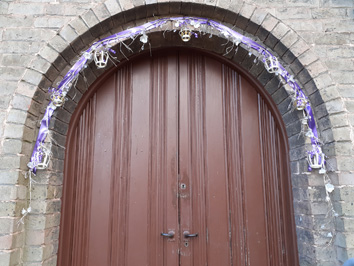 Entrance to the church decorated with crowns