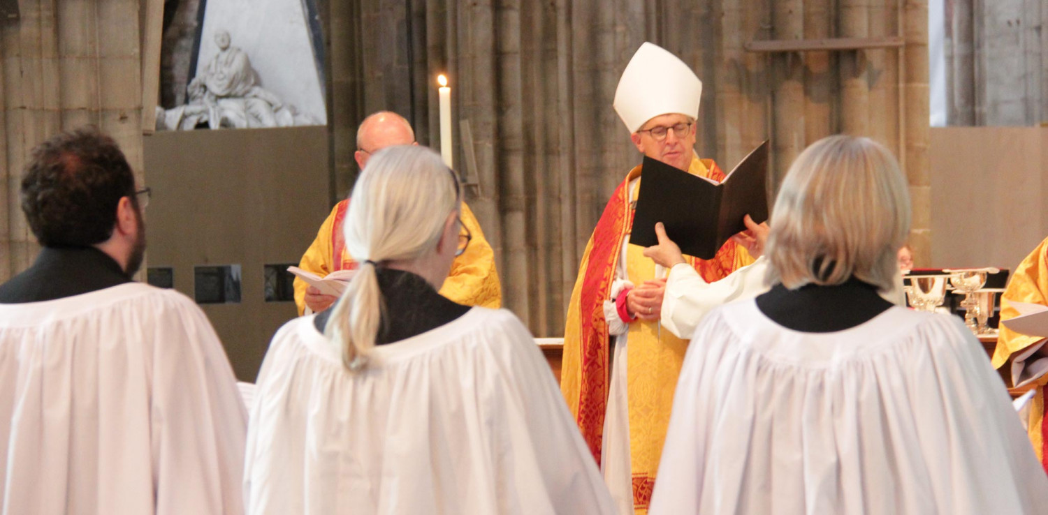 Bishop Martin ordaining priests