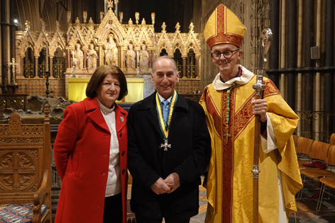 Alan with his wife and Bishop John