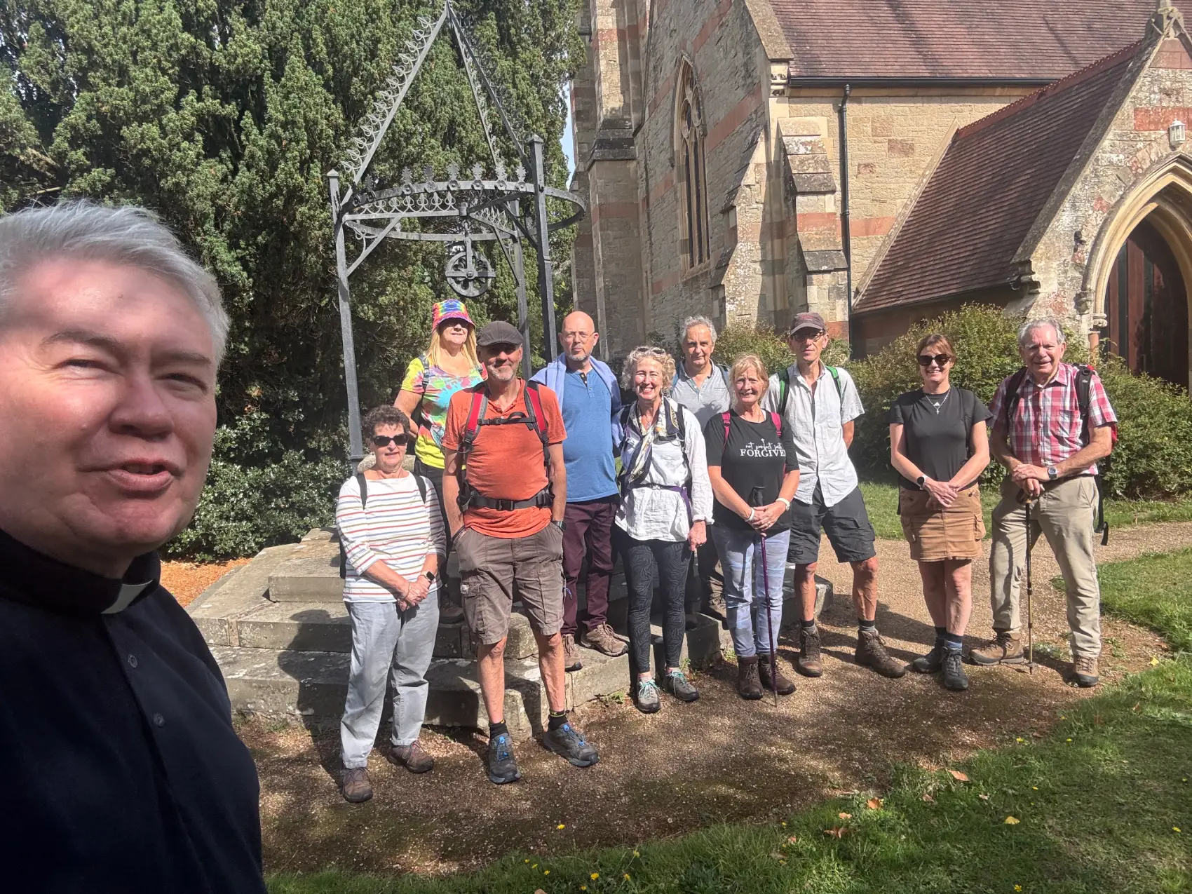 Gary Crellin takes a selfie with pilgrims outside Madresfield church