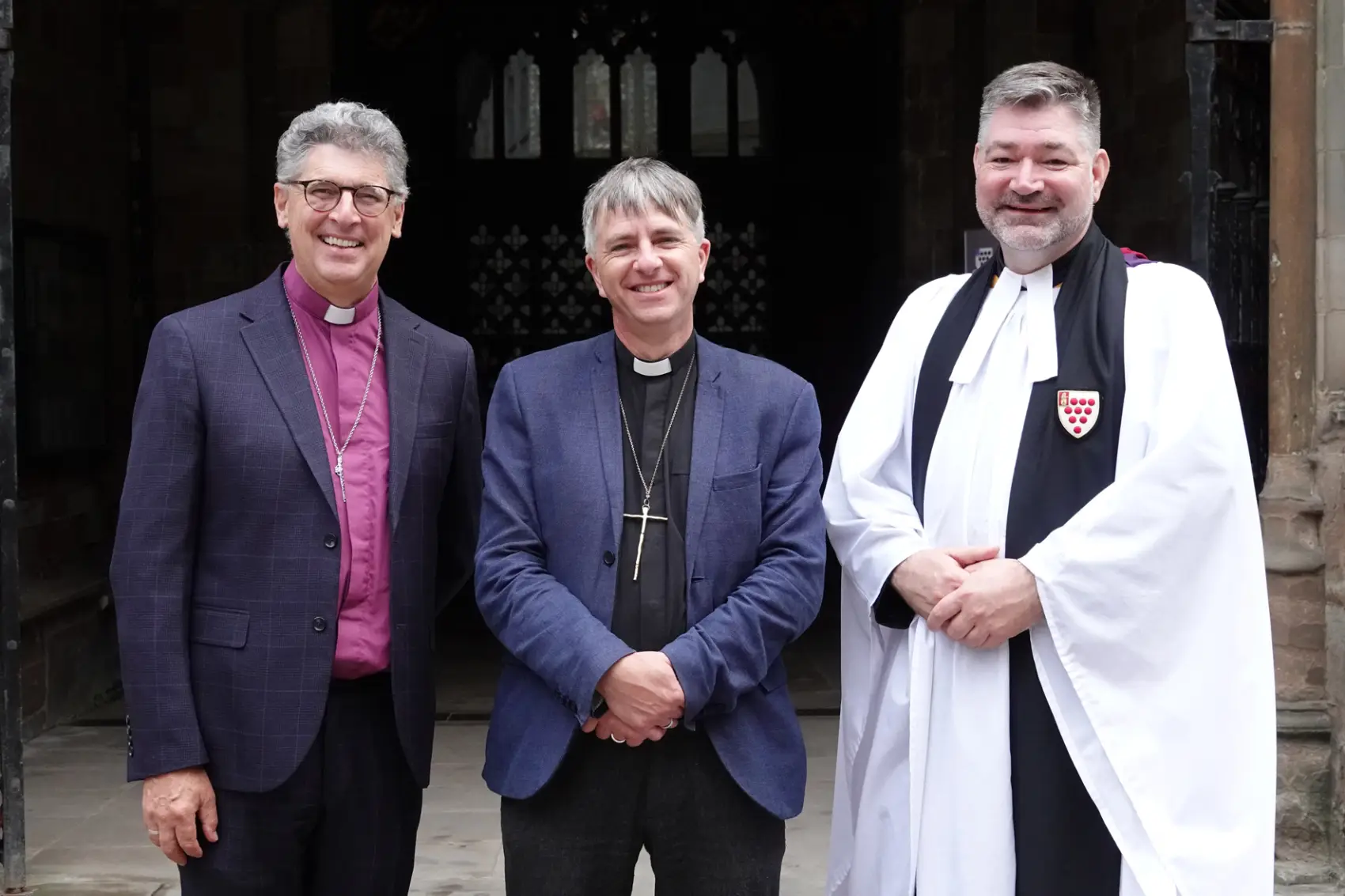 Bishop Martin, Bishop Hugh & Stephen Edwards standing in front of the doors of the Cathedral
