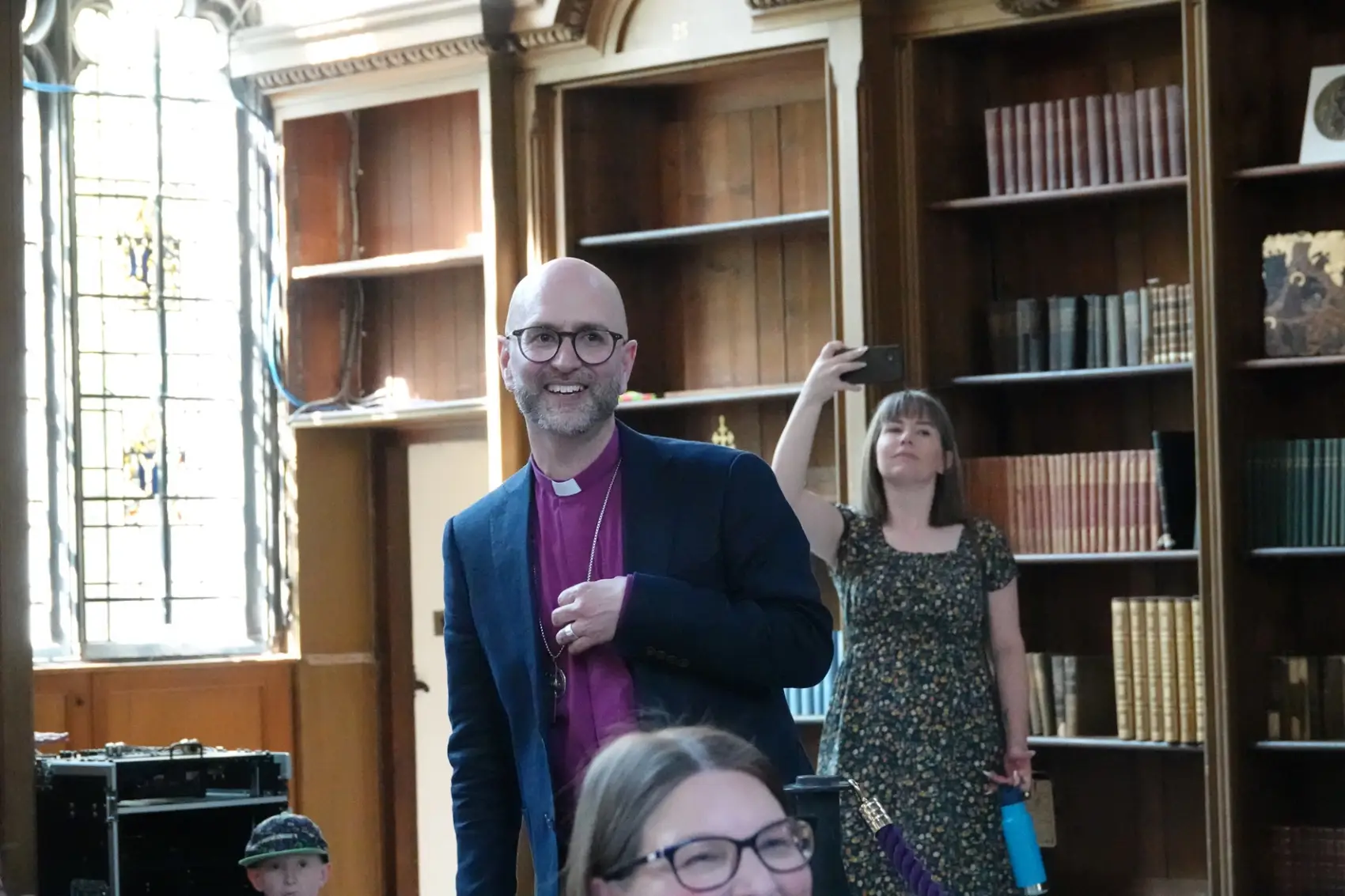 Bishop James standing in the great Hall at Lambeth palace as he speaks to those gathered