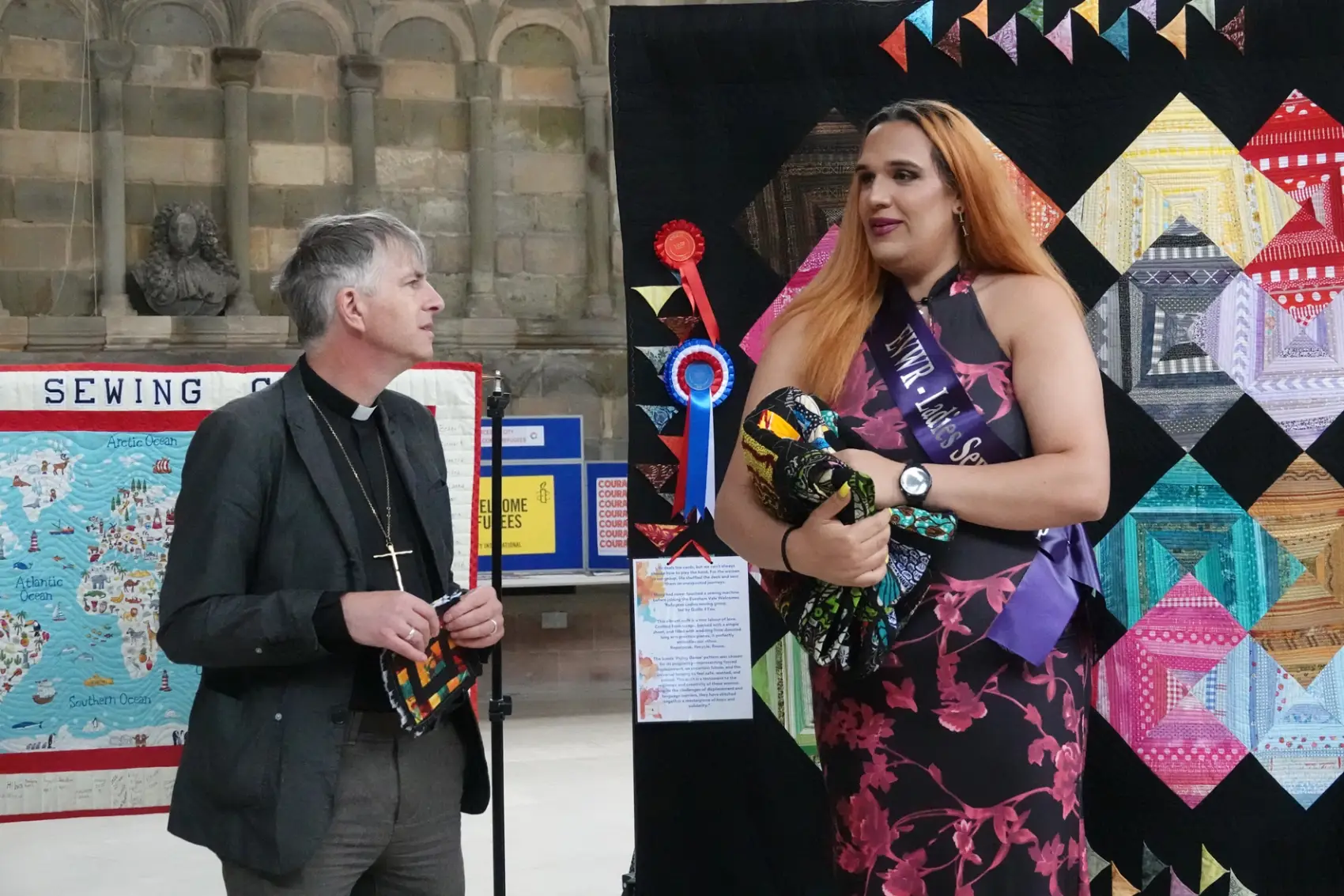 Bishop Hugh standing next to Lilly at the Cathedral quilt exhibition