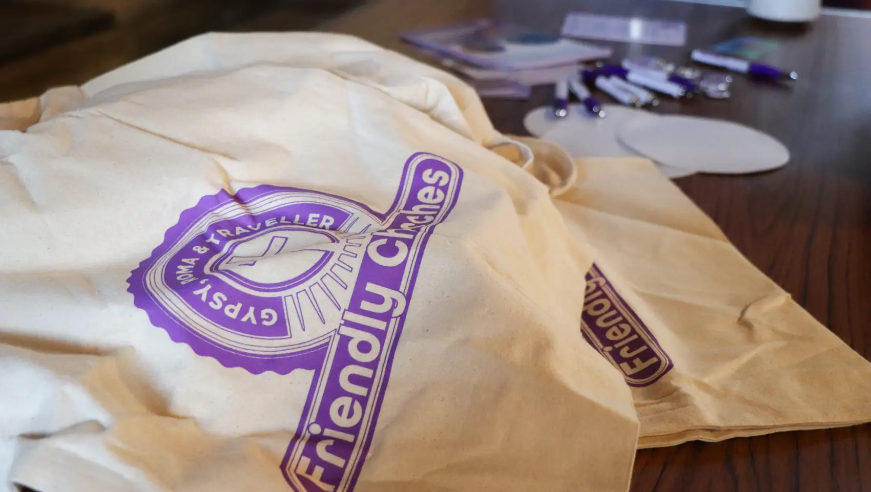 A pile of Gypsy Roma Traveller Friendly tote bags