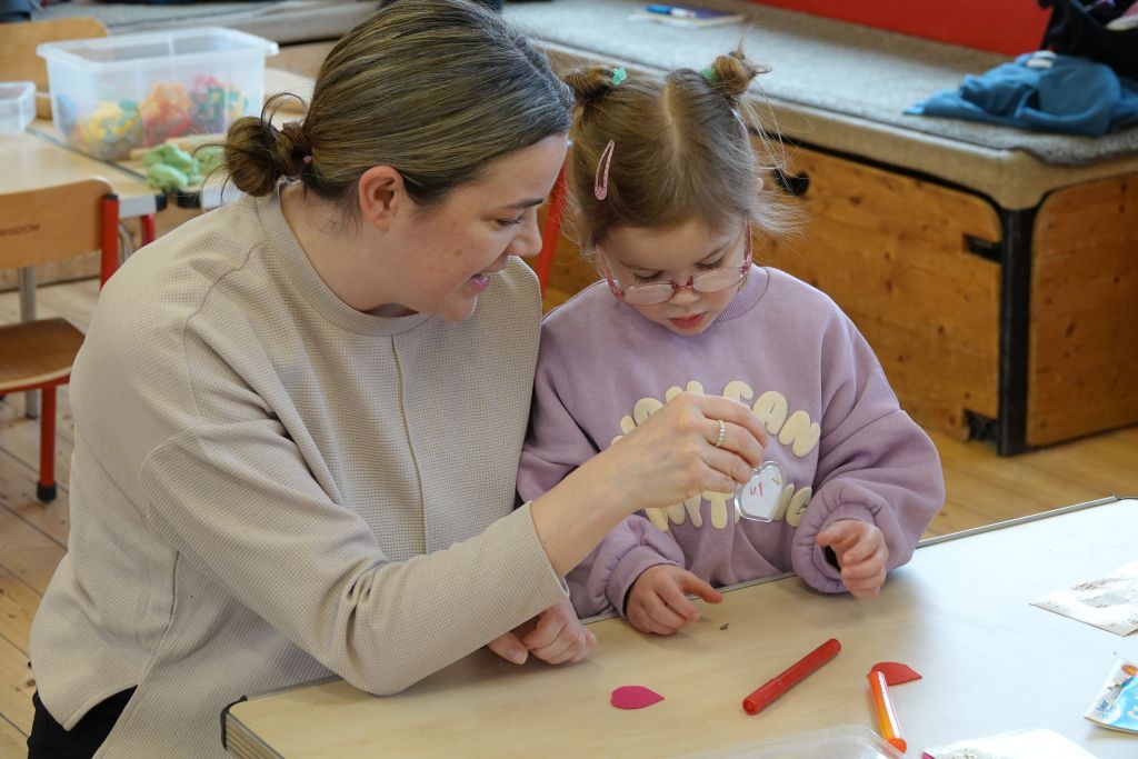 A family make a keyring together at Activity Church