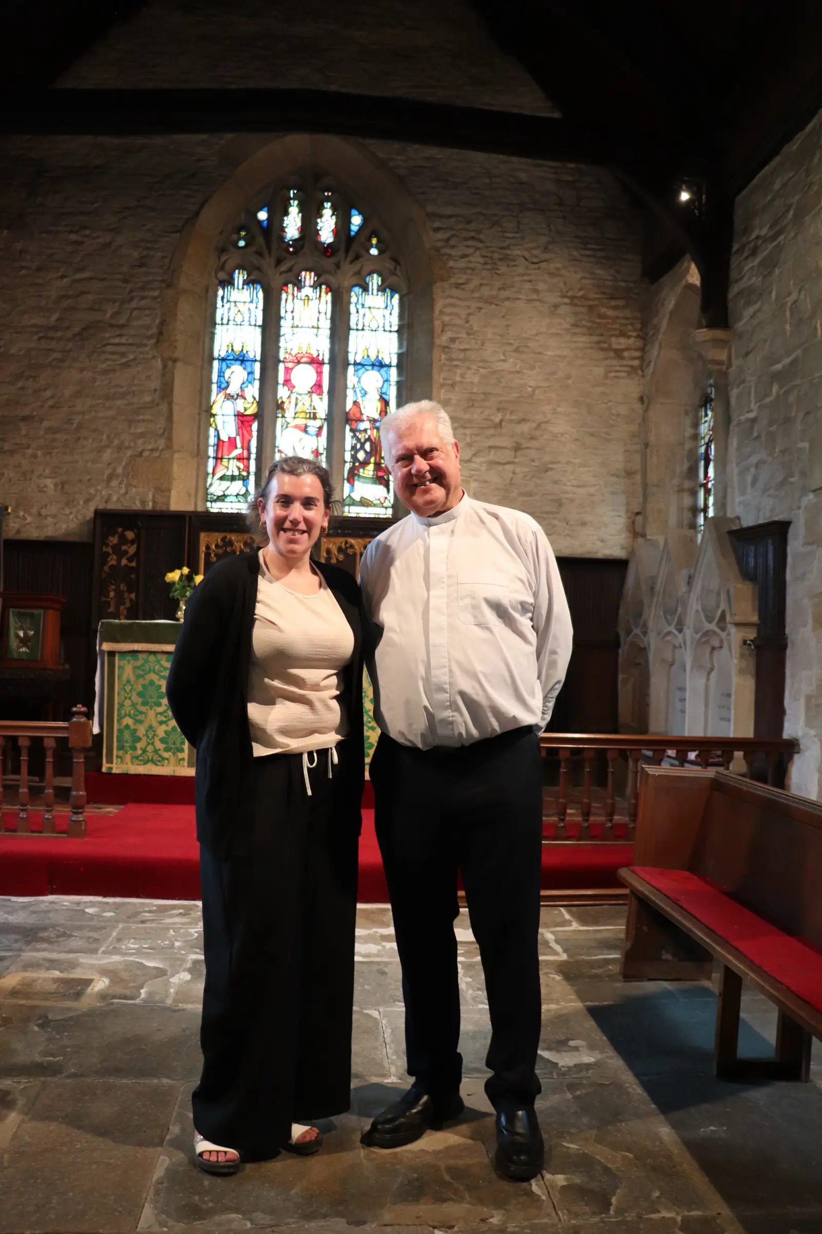 Abi Smith standing alongside Andy Green in church
